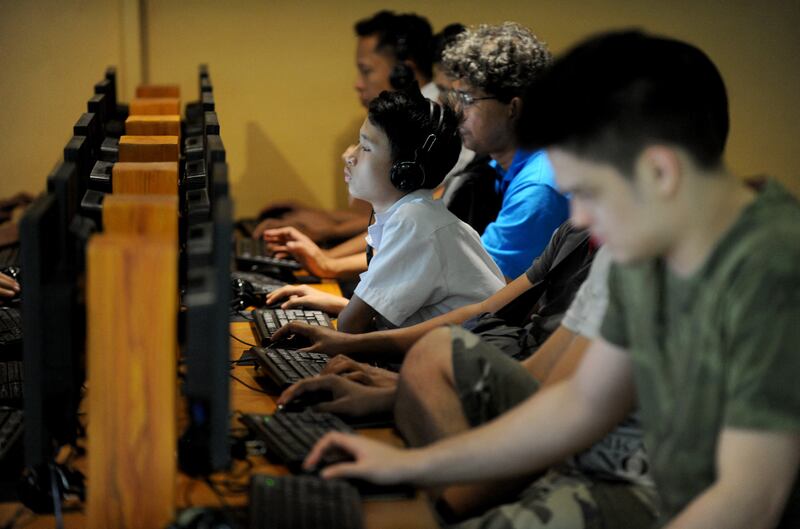 Filipino youths gather at an Internet cafe in Manila, Feb. 18, 2014.