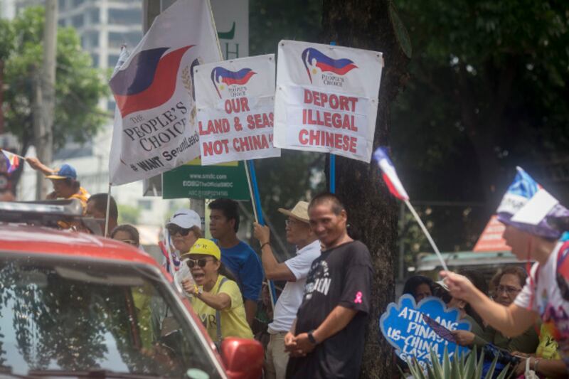 Filipino activists protest outside the building housing the Chinese Embassy in Manila, July 12, 2019. (Luis Liwanag/BenarNews) 