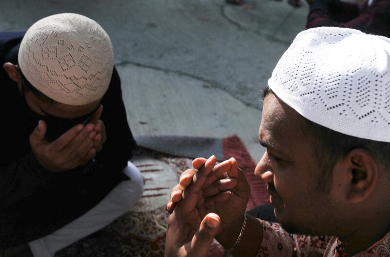 220502-eid-malay-men-pray.JPG