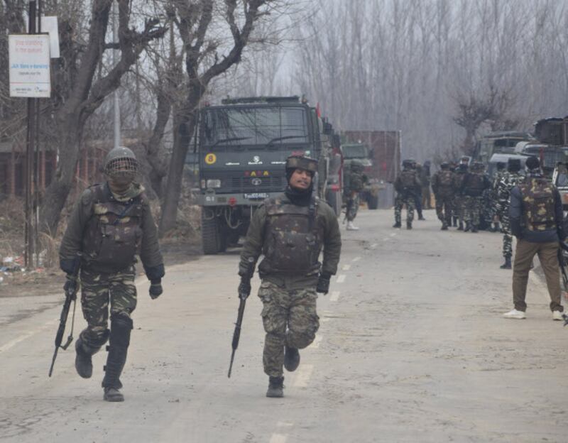 Soldiers gather near the shooting site in Kashmir's Pulwama district, Feb. 18, 2019. [Sheikh Mashooq/ BenarNews] 