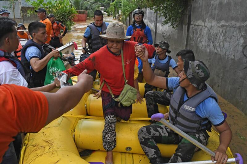 Police rescue a resident of Cagayan de Oro, Dec. 22, 2017.