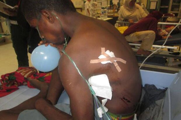 A man shot by soldiers undergoes treatment at Mitra Masyarakat Hospital, in Timika, Papua, Indonesia, Aug. 28, 2015.