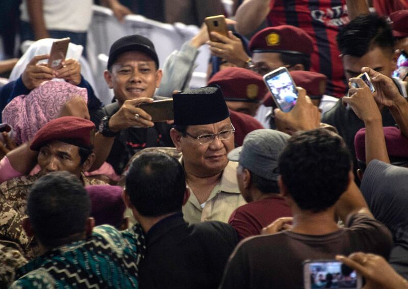 Indonesian presidential candidate Prabowo Subianto (center), a former military general, is welcomed by his supporters in Mojokerto, West Java province, Feb. 24, 2019. [AFP]