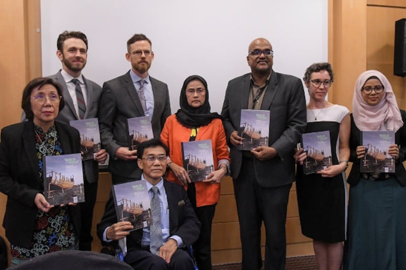 Fortify Rights and Suhakam members display their report, “Sold Like Fish,” based on a multi-year investigation of human trafficking camps and mass graves along the Malaysia-Thai border, on the sidelines of a press conference in Kuala Lumpur, March 27, 2019. [S. Mahfuz/BenarNews]