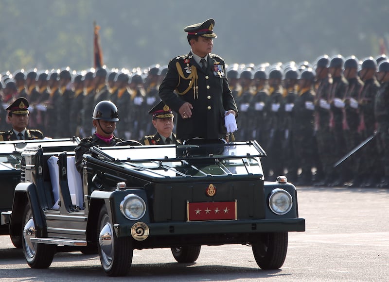 AP prayuth standing in the car.jpg