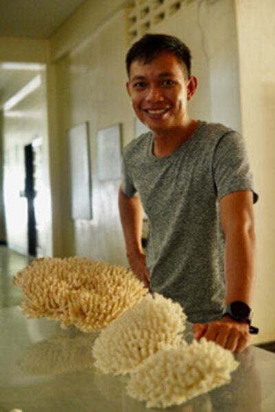 Researcher Charlon Ligson claims to have found a faster way to raise an endangered coral, Dec. 16, 2022. [Aie Balagtas See/BenarNews]