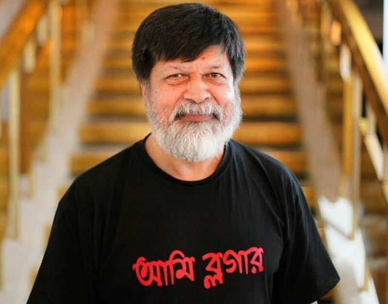 In this undated photo, Shahidul Alam wears a T-shirt that says ‘I am a Blogger' in Bengali. [Courtesy Drik]