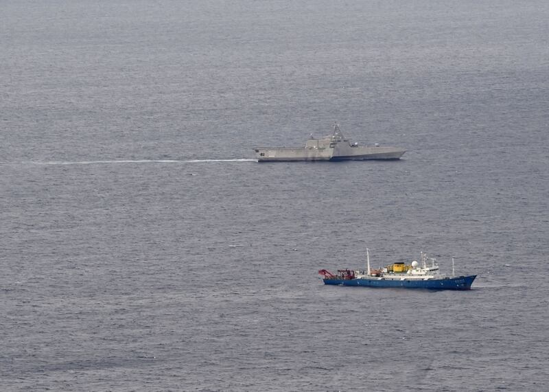 The USS Gabrielle Giffords (top) patrols in the South China Sea near the Chinese survey ship Hai Yang Di Zhi 4, July 1, 2020.