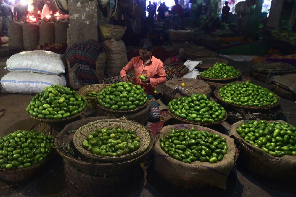 A vendor prepares his stall at a Dhaka market during an opposition-led strike and blockade, Feb. 11, 2015.