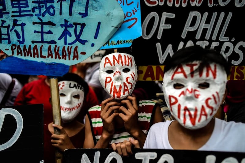 Filipino activists protest in front of China's Embassy in Manila, as Chinese President Xi Jinping arrived in the Philippines for a state visit, Nov. 20, 2018. [Karl Romano/BenarNews]