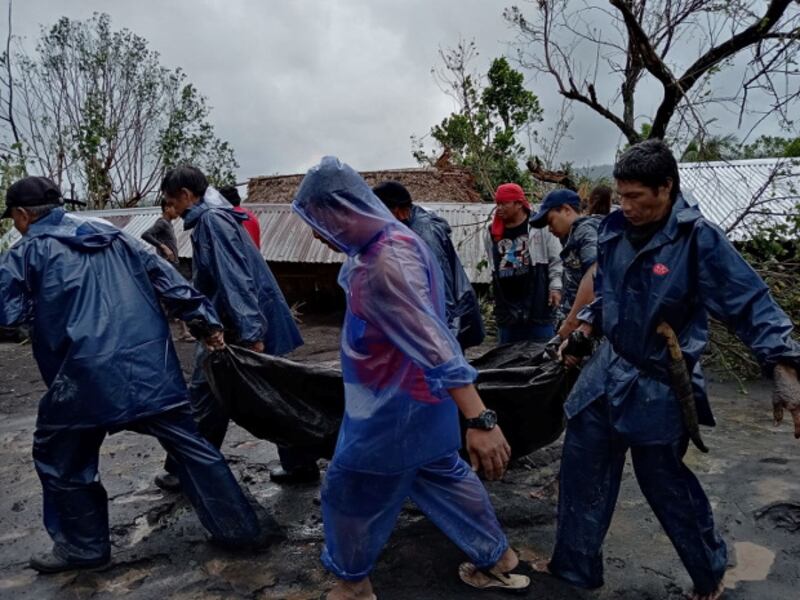 People carry the body of a victim in the aftermath of Typhoon Goni in San Francisco, Guinobatan, Albay province, Philippines, Nov. 1, 2020. (Shyneth Occidental Montero/Handout Picture/Reuters)