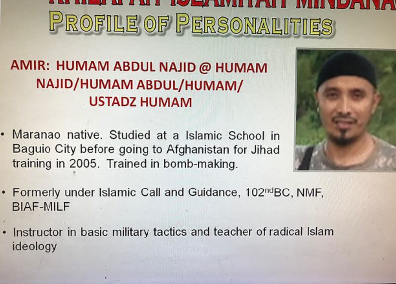 A profile and photograph of Filipino militant Abu Dar is seen in this photograph handed out to reporters by the Philippine Army, January 2018. [HO/Philippine Army]