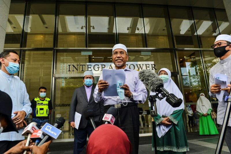 PAS vice president Idris Ahmad speaks to the media in front of the Integrate Tower in Kuala Lumpur, where the French Embassy is located, Oct. 27, 2020.
