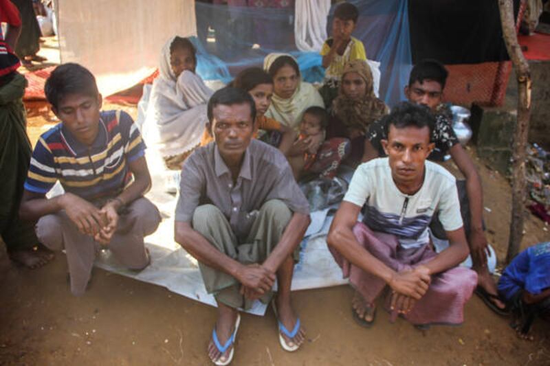 Mohammad Javed (right), a Rohingya refugee in Cox's Bazar, says his 11-member family barely gets by on one meal a day, Nov. 8, 2017. [Rohit Wadhwaney/BenarNews]