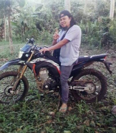 Usop Nasif, who was killed in a gun battle with police and troops, is seen posing on a motorcycle in this undated photo. [Handout Westmincom]
