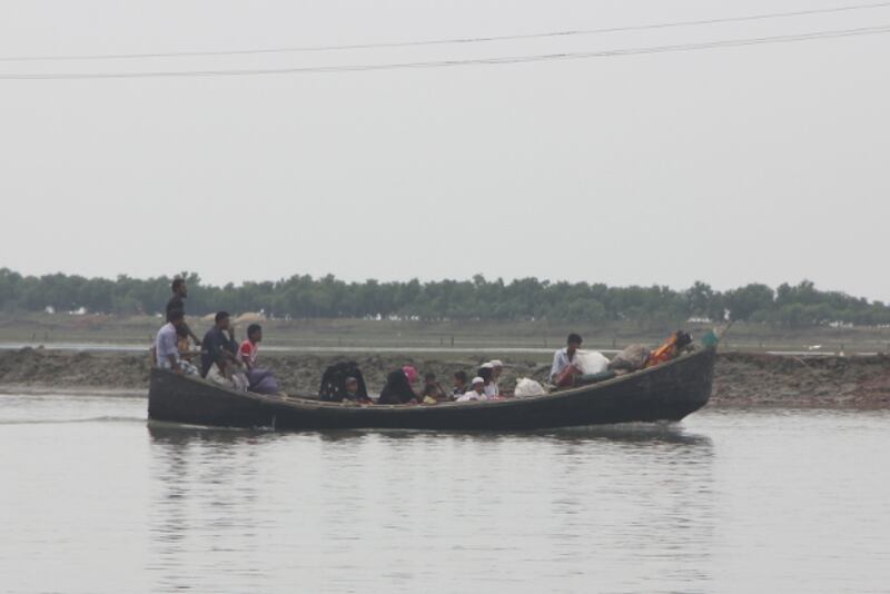 A boat ferries Rohingya refugees to Dakhin Para in Cox's Bazar, Bangladesh, Nov. 2, 2017.