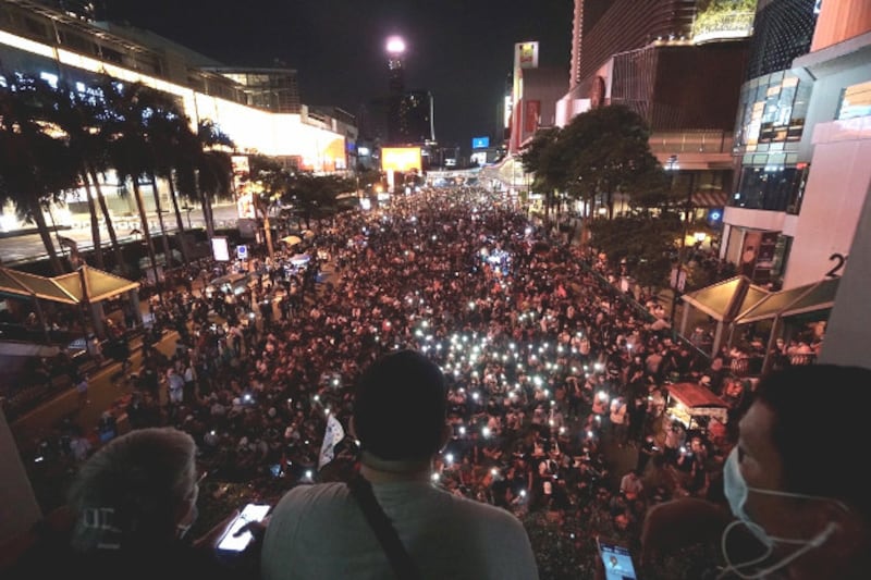 Pro-democracy activists gather near the Erawan Shrine in downtown Bangkok, one day after a rally drew pro-monarchy counter-protesters, Oct. 15, 2020. [Nontarat Phaicharoen/BenarNews] 