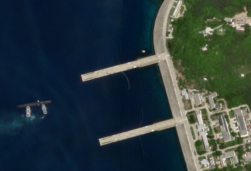Satellite imagery shows a Type 093 sub getting pushed toward a pier at China's Yulin Naval Base, Aug. 19, 2020. [Planet Labs Inc.]