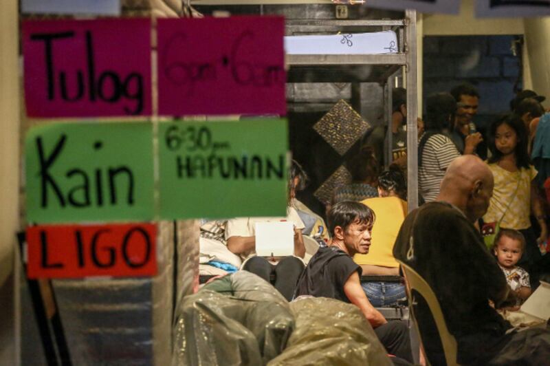 A restaurant in Quezon City, near Manila, is converted into an emergency shelter at night to cater to Philippines capital's homeless after the government imposed a sweeping quarantine to control the spread of COVID-19, March 21, 2020. [Basilio Sepe/BenarNews]