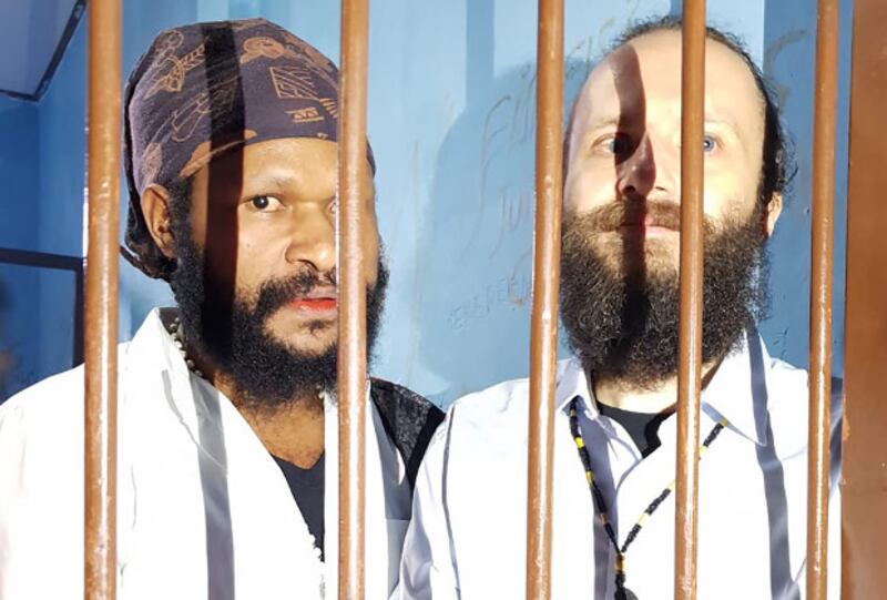Jakub Fabian Skrzypski (right), and Simon Magal are seen in the holding cell at Wamena District Court in Jayawijaya, Papua, Jan. 14, 2019. (Courtesy of Latifah Anum Siregar)