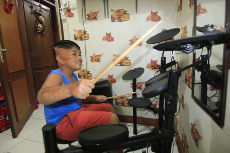 Alvaro plays the drums at his home in Samarinda, Oct. 11, 2020. 