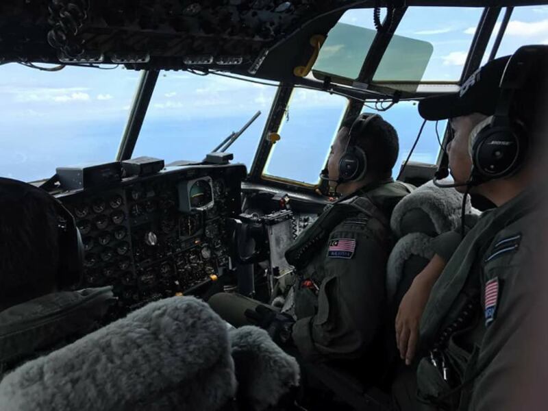 Malaysian Air force officers fly a surveillance mission over the Sulu Sea, near Basilan Island in the southern Philippines, during the first day of a Trilateral Air Patrol initiative also involving Indonesia and the Philippines, Nov. 8, 2017. 