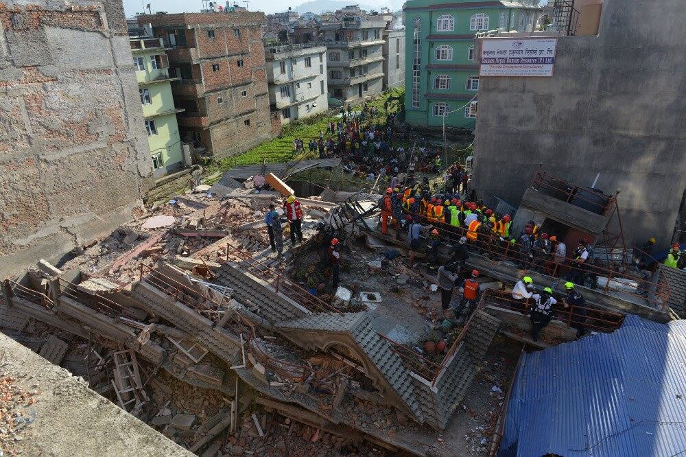 A rescue team searches for survivors at a collapsed building in Kathmandu after a 7.3-magnitude earthquake, May 12, 2015.