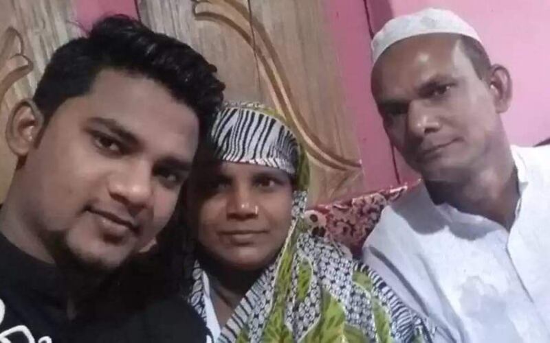 Rayhan Kabir (left) sits with his mother, Rasheda Begum, and his father, Shah Alam, at their residence in Narayanganj city, Bangladesh, in this undated photo. [Courtesy Rayhan Kabir's family]