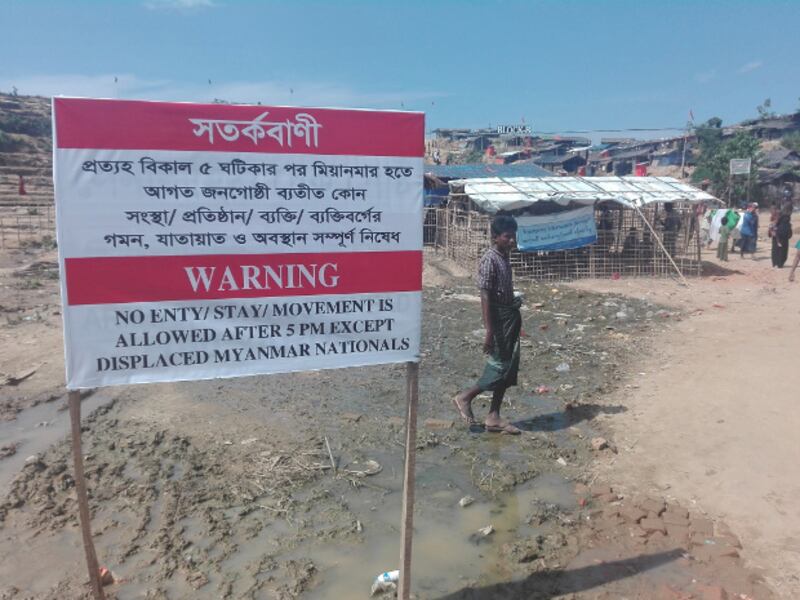 A sign outside the Jamtoli refugee camp in Ukhia, Bangladesh warns outsiders to keep away at night, Nov. 6, 2017. (Tushar Tohin/BenarNews)