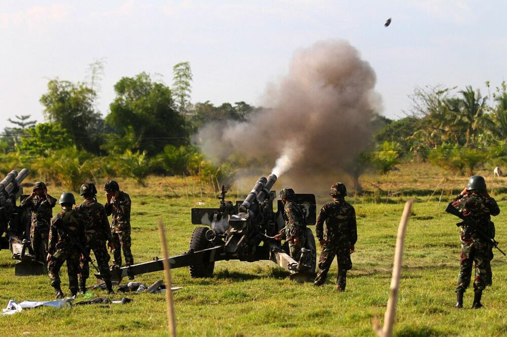 Soldiers from the Philippine 6th Infantry Division fire a field gun as they take part in a clearing operation targeting Islamic State-linked in southern Maguindanao province, Aug. 20, 2018