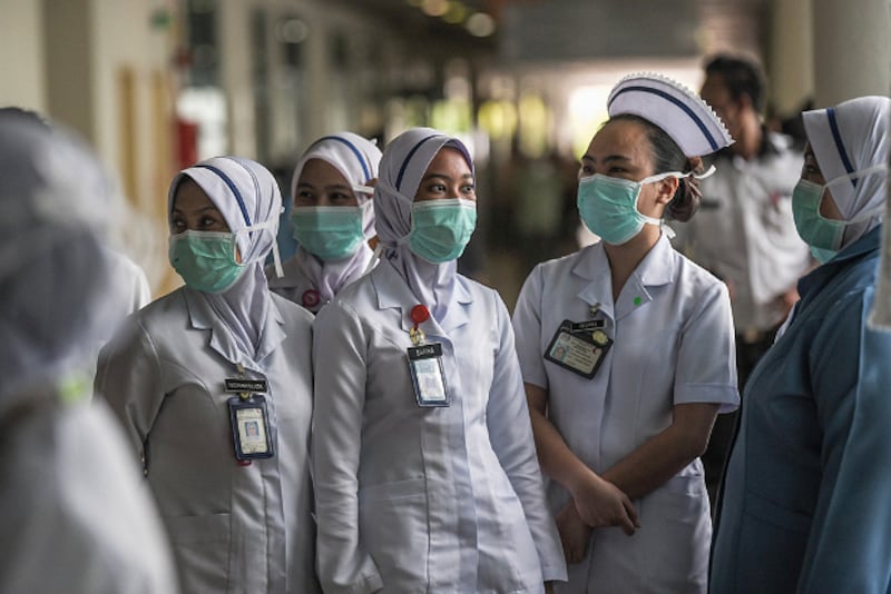 Health officials and nurses wear masks at the Sungai Buloh Hospital in Selangor, Malaysia, March 12, 2020. [S. Mahfuz/BenarNews]