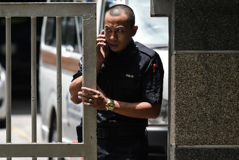 A Royal Malaysian Police officer stands at the main gate of the forensics wing of the Kuala Lumpur Hospital, which housed the body of Kim Jong Nam, March 29, 2017. 