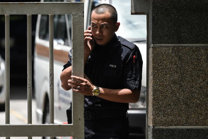 A Royal Malaysian Police officer stands at the main gate of the forensics wing of the Kuala Lumpur Hospital, which housed the body of Kim Jong Nam, March 29, 2017.