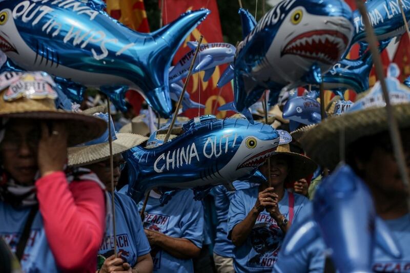 Protesters in Manila call on China to leave the West Philippines Sea (WPS), the Philippines' name for the South China Sea, in this file photo dated July 22, 2019.