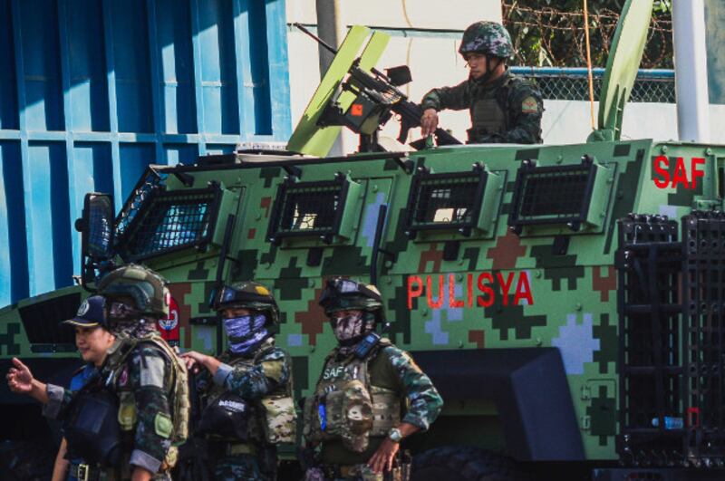 Philippine police man a Special Action Force anti-personnel vehicle during a security lock down at Camp Bagong Diwa, in preparation for the 2009 Ampatuan massacre verdict, Dec. 19, 2019. [Jojo Riñoza/BenarNews]